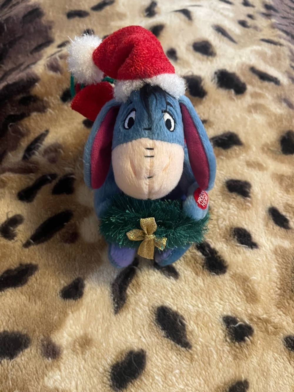 Disney Eeyore Plush in Blue with Red Santa Hat and Green Wreath